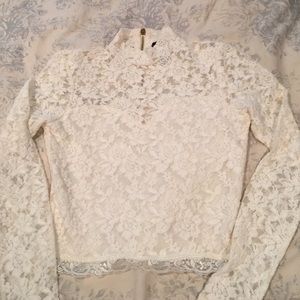Ivory lace brand-new adorable top in a size small.