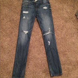 Distressed denim jeans