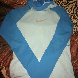 Blue Nike hoodie with ponytail hole.