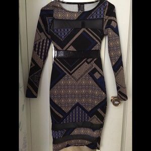 Long sleeve, knee high dress.