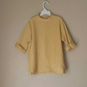 Yellow crop top with a turtle neck