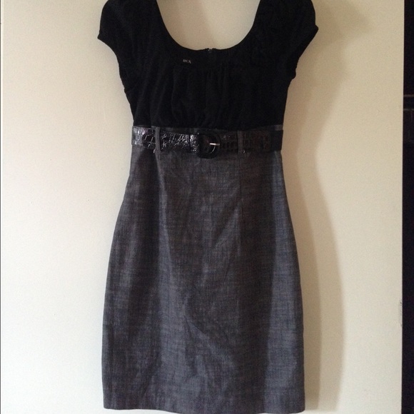 Gray and black dress falls right above the knees.