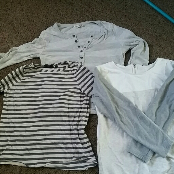 Three grey long sleeve shirts