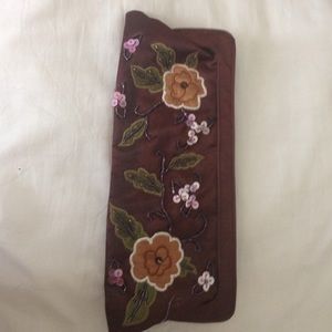 Brown clutch with flower details