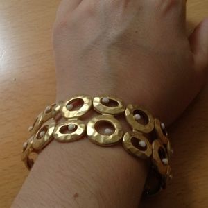 Gold bracelet with white stones