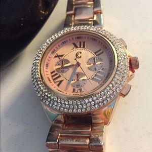 Diamond surrounding clock face, rose gold watch