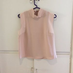 Pale pink sleeveless collared blouse