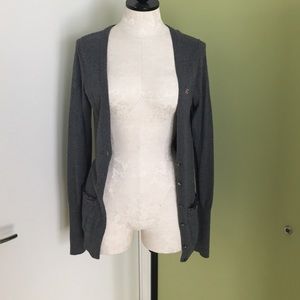 Gray cardigan sweater.