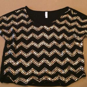Short sleeve top with gold sequin chevron design.