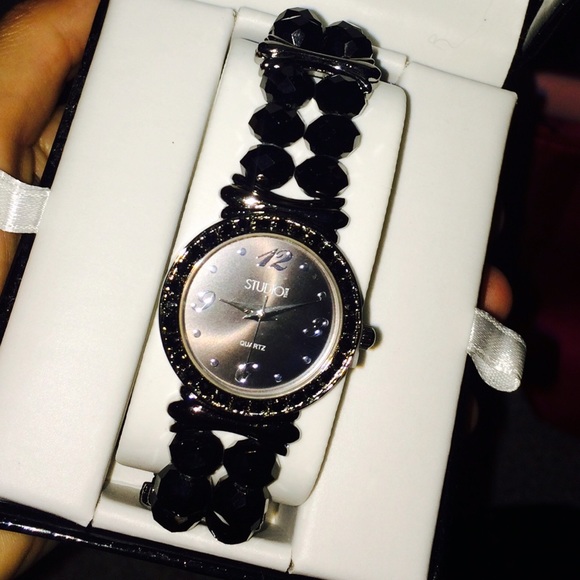 Black, stretchy bracelet-like, watch.