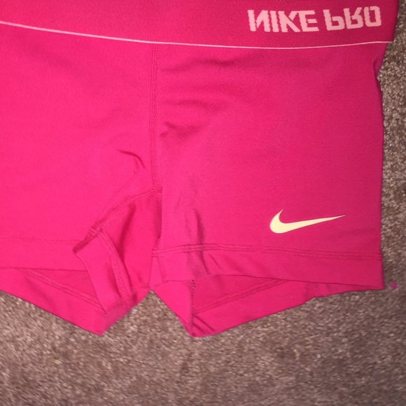 Bright pink neon Nike pros