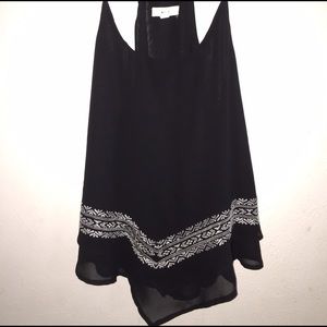 Black flowy tank with bandana design in white.
