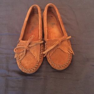 Norstrom's brown Minnetonka moccasins