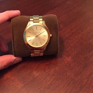 Mens Michael Kors gold luxury watch.