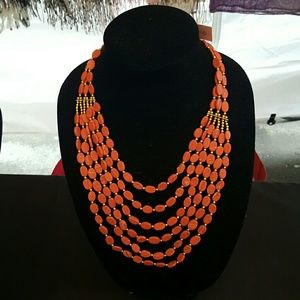 Muilti string red necklace