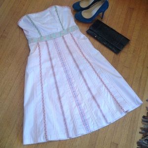 Zinc pink dress adorned with tapestry ribbons