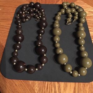 a  set of large Green and Brown pearls.