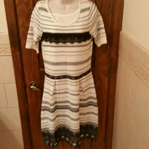 A cute new black and white sweater dress