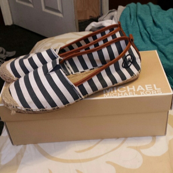 Michael Kors canvas slip ons