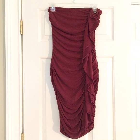 Deep red, fitted dress.