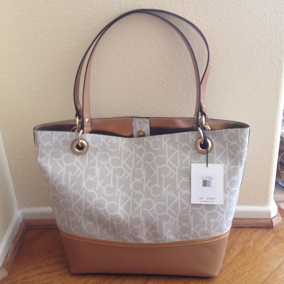 Calvin Klein Accessories - Calvin Klein. NWT bucket style handbag w/ snap.