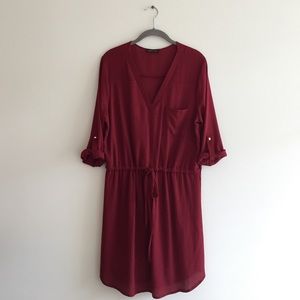Ruby red v-neck, drawstring waisted dress.