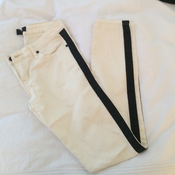 White jeans with black striped sides