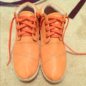 Orange high top sneakers