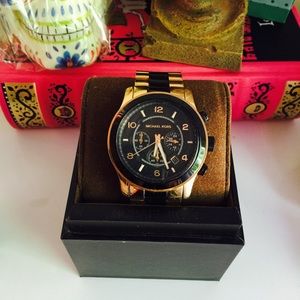 Black and gold Michael Kors Runway Watch