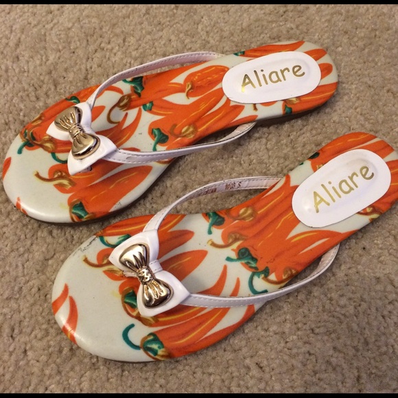 White and orange flip flop