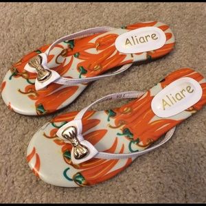 White and orange flip flop