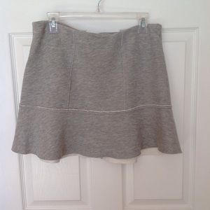 Grey sweat material skirt.