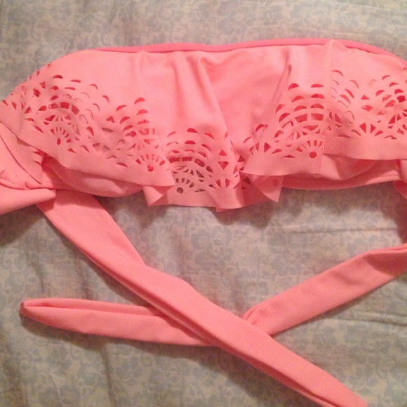 Brand new bikini top. Light orange size medium