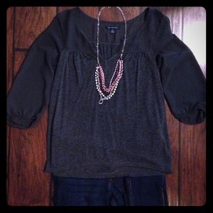 Top with sheer sleeves