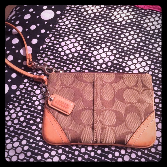 Coach Clutches & Wallets - A brown coach wristlet