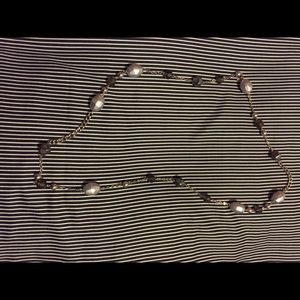 Pretty, long, silver tone necklace