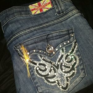 Machine Brand distressed jeans with bling pockets