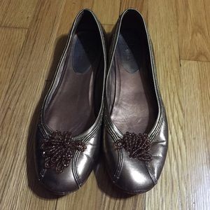 Bronze Cole Haan flats with beaded embellishment