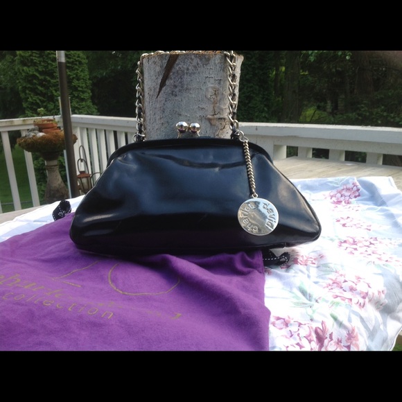 Black patent leather medium satchel.