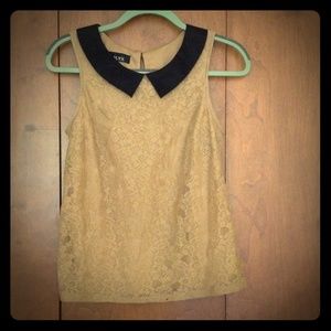 Tan shirt with black collar