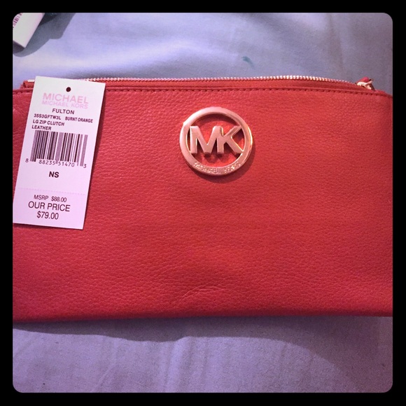 Burnt orange MK clutch