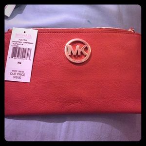 Burnt orange MK clutch