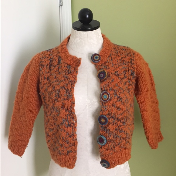 Orange and turquoise Free People sweater.