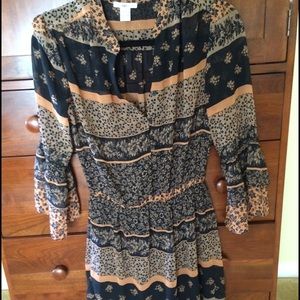 Black dress striped with rust and black flowers