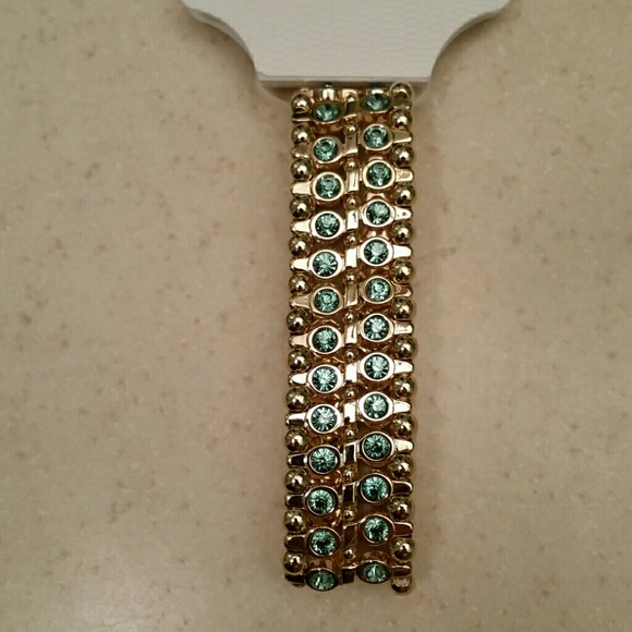 Dana Buchman Jewelry - Stretch bracelet. Gold w/teal-deep green gemstones