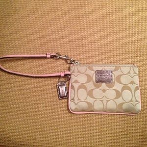 Light pink and tan Coach wristlet