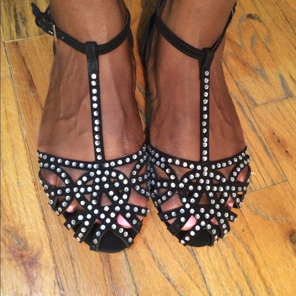 Black flats with embellishment.