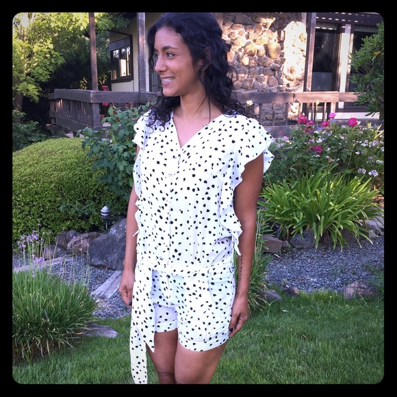 Adorable white romper with black hearts