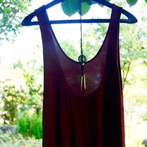 Red tank top with complementary necklace.