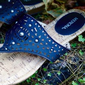 Black, decorated sandals.